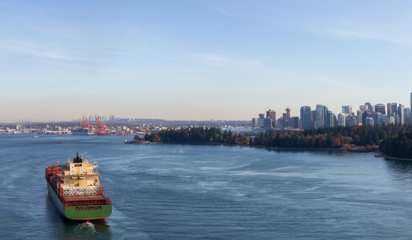 A freighter approaches downtown Vancouver. Credit: edb3_16, iStock.