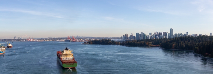A freighter approaches downtown Vancouver. Credit: edb3_16, iStock.